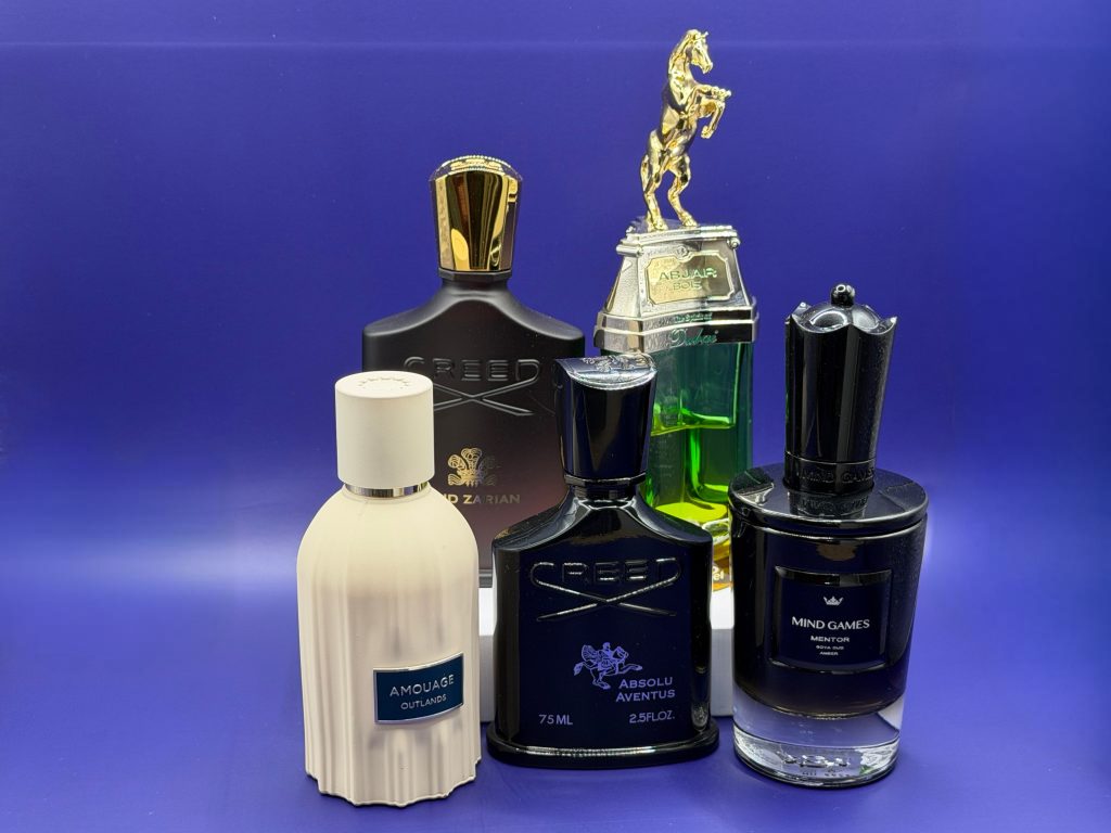 Herrendüfte zu Silvester 2026: Creed Aventus Absolu, Mind Games Mentor, Amouage Outlands, Creed Oud Zarian und The Spirit of Dubai Abjar Bois